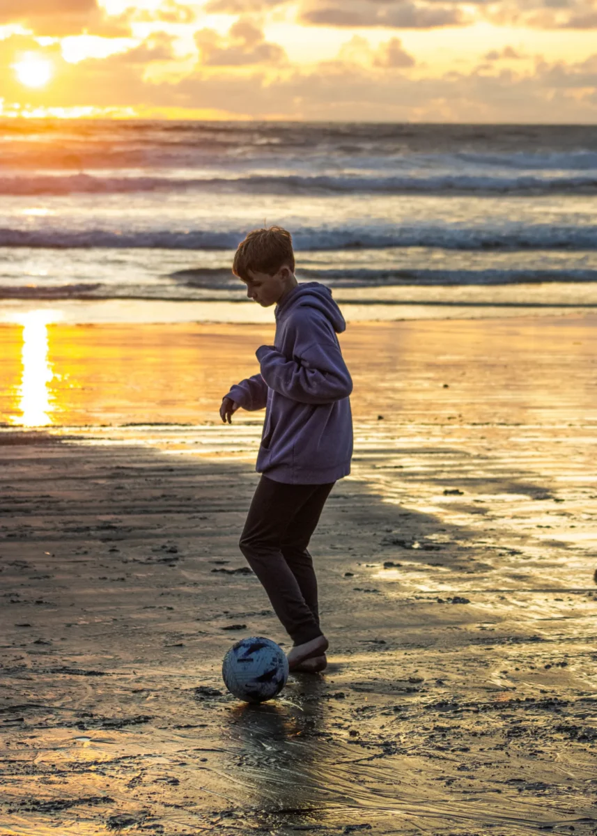 Soccer at the beach by Andrew Horn